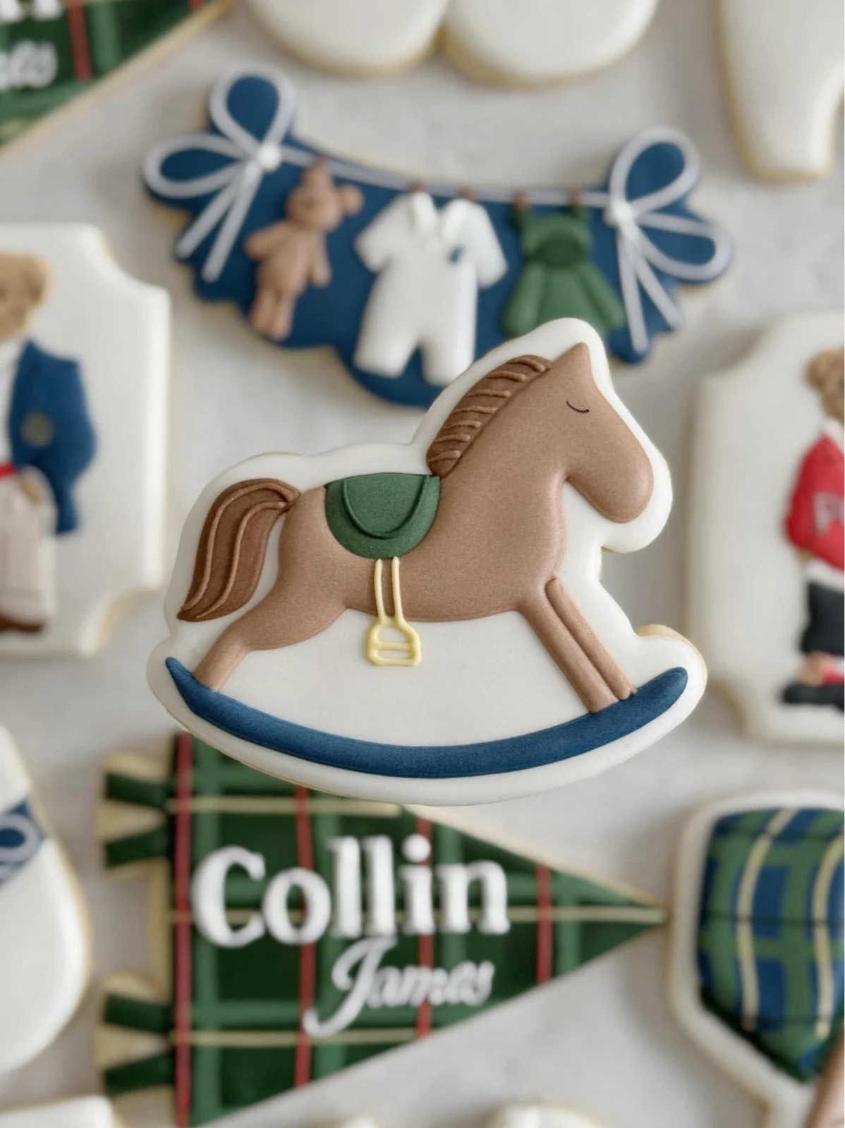 Close-up of a custom rocking-horse cookie for the baby shower