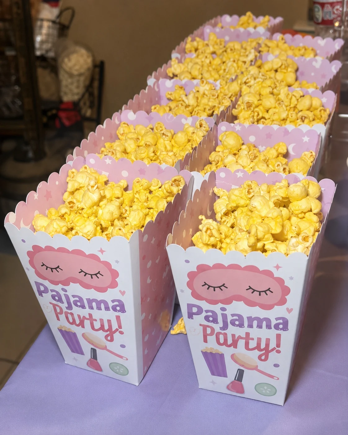 Pajama Party popcorn boxes lined up on the snack table