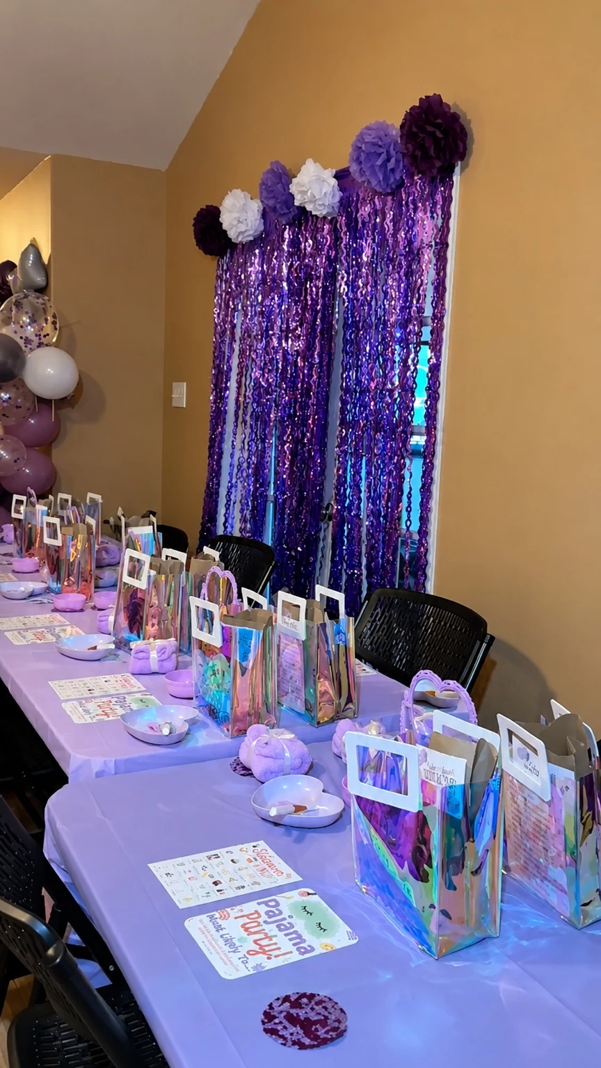 Wide view of the spa-party table with favors, place settings, and shimmer backdrop