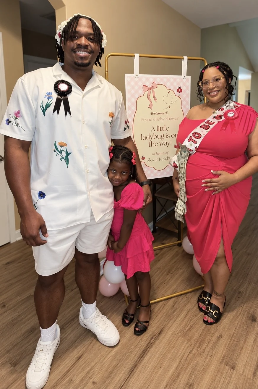 Family together at the ladybug baby shower