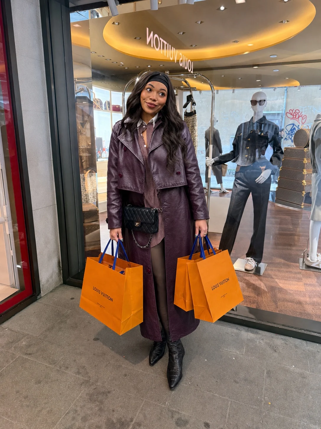 Jenica carrying Louis Vuitton shopping bags in Europe