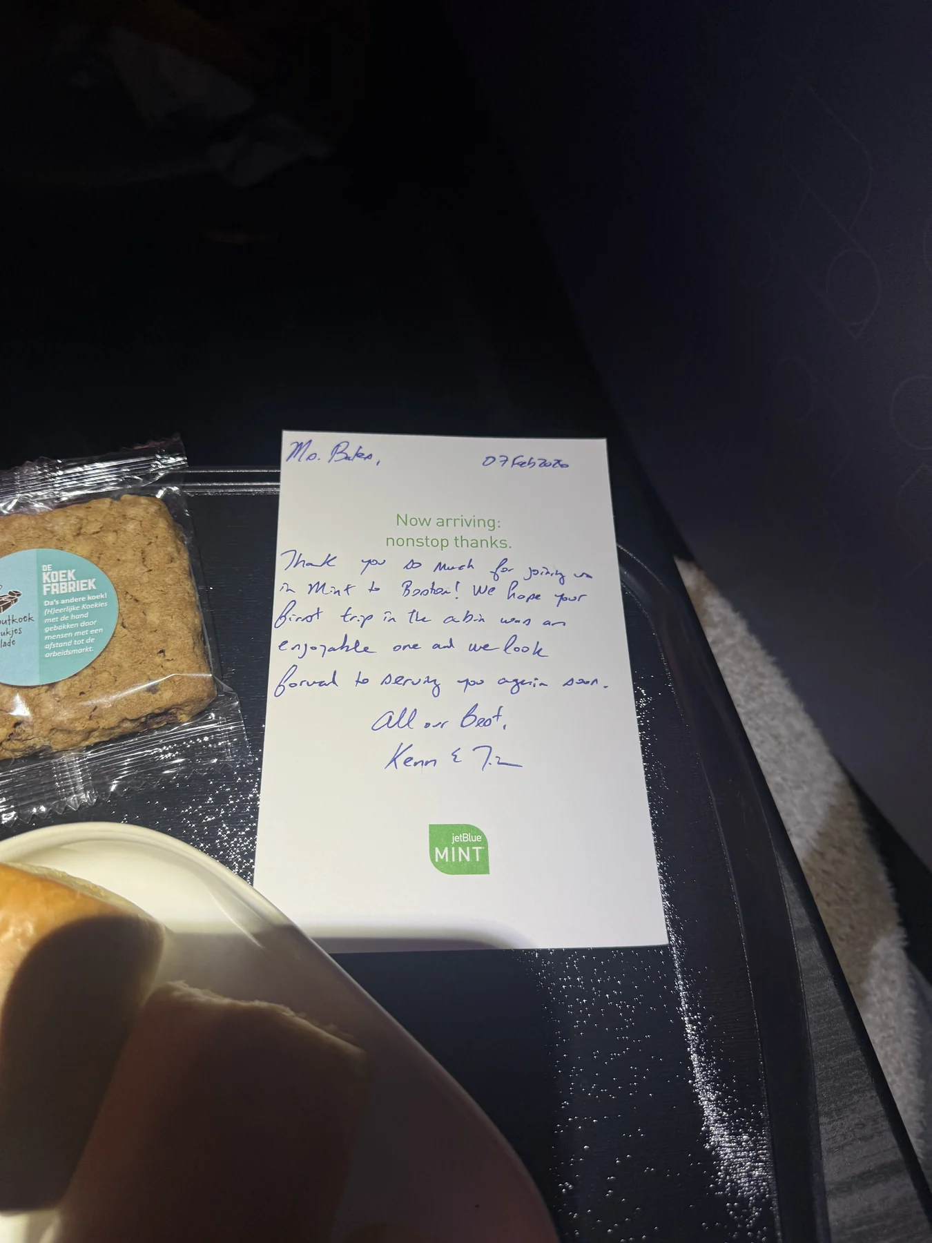 A handwritten note and snack on JetBlue Mint