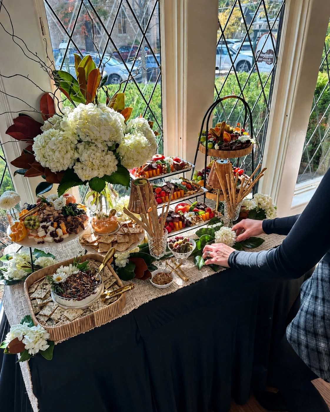 Jenica making final on-site adjustments to the grazing-table display